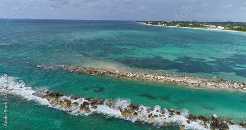 Fototapeta Naklejka Na Ścianę i Meble -  Climate Change - Increasing Sea Levels and Coastal Erosion. Tropical Ocean View - Aerial Video Footage.