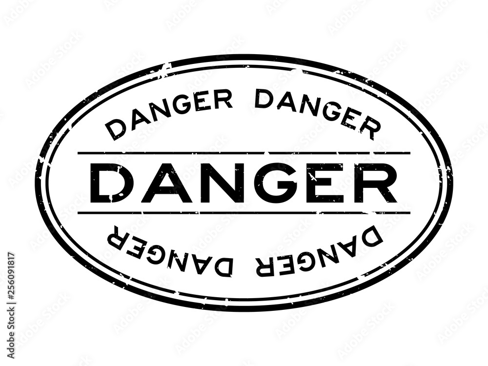 Grunge black danger word oval rubber seal stamp on white background