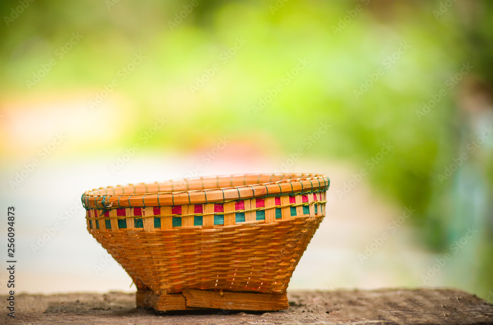Crafts bamboo basket weave on old wooden with summer Crafts bamboo basket weave on old wooden with summer