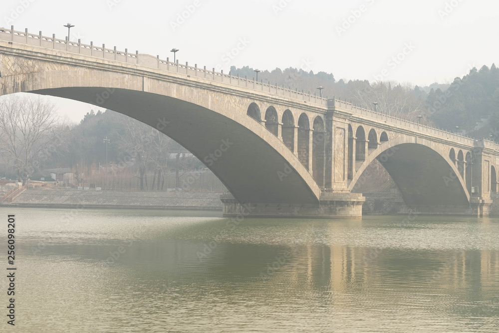 The walk way along the Longmen Grottoes, at Luoyang City, Henan Province China. The walk way along the Longmen Grottoes, at Luoyang City, Henan Province China.