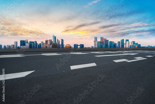 Foreground highway asphalt pavement city building commercial building office building