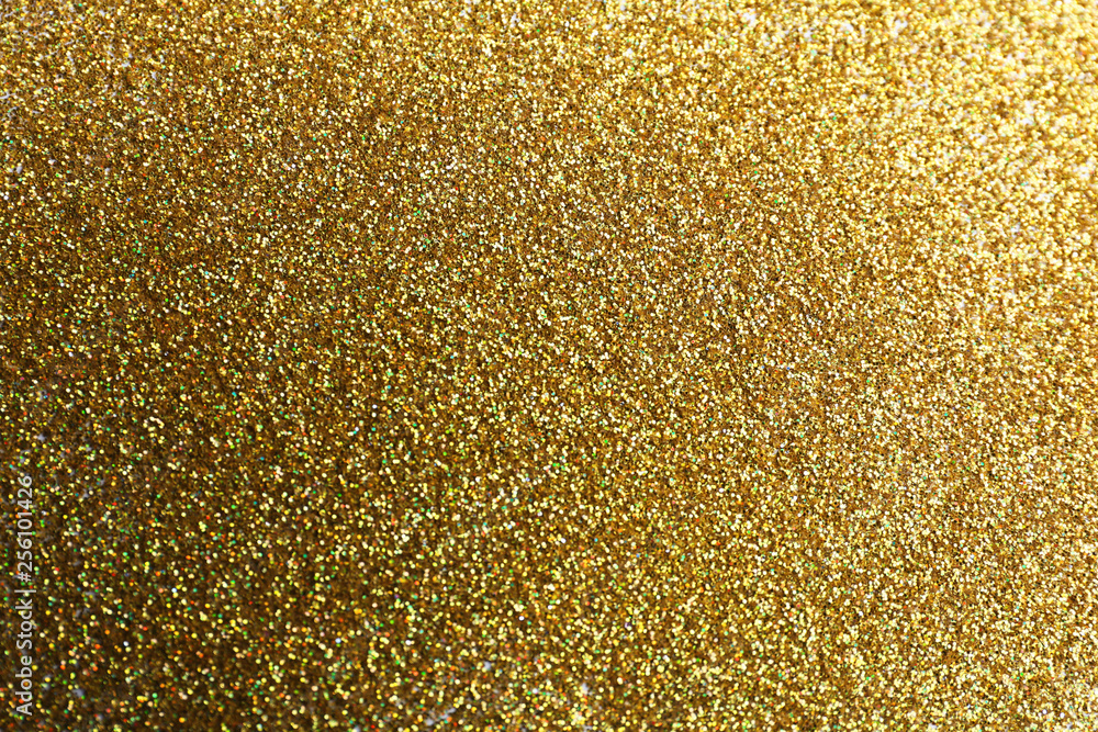 Closeup view of sparkling golden glitter background Closeup view of sparkling golden glitter background