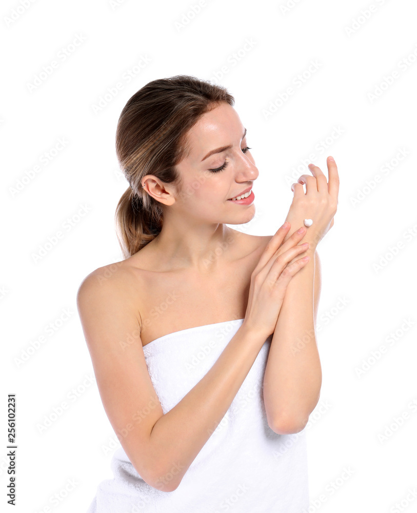 Young woman applying cream on her hand against white background. Beauty and body care Young woman applying cream on her hand against white background. Beauty and body care