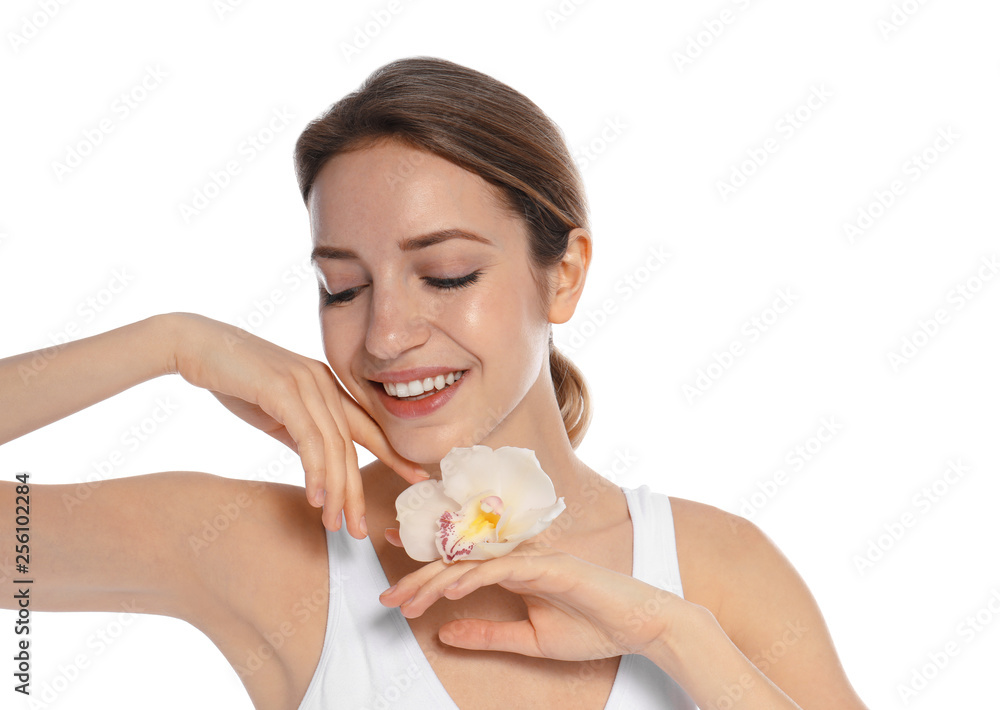 Portrait of young woman with perfect smooth skin and flower on white background. Beauty and body care Portrait of young woman with perfect smooth skin and flower on white background. Beauty and body care