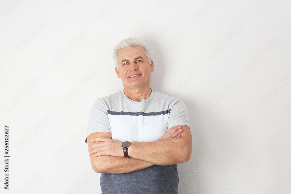 Portrait of handsome mature man on light background Portrait of handsome mature man on light background