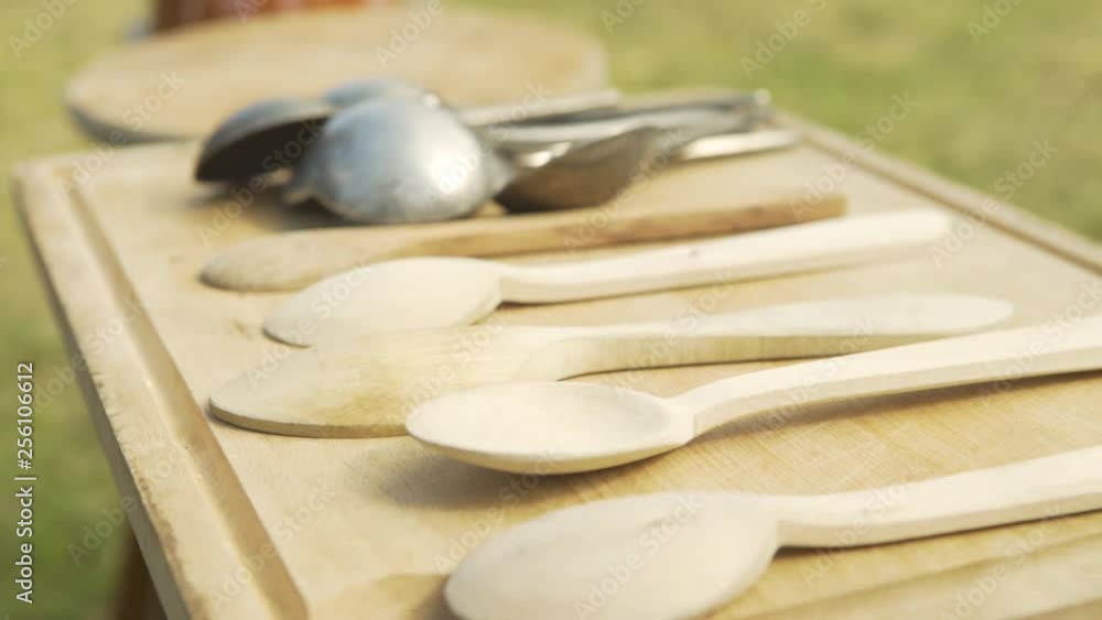 Set of spoons on a cutting board, cooking and camping. Close up. Set of spoons on a cutting board, cooking and camping. Close up.