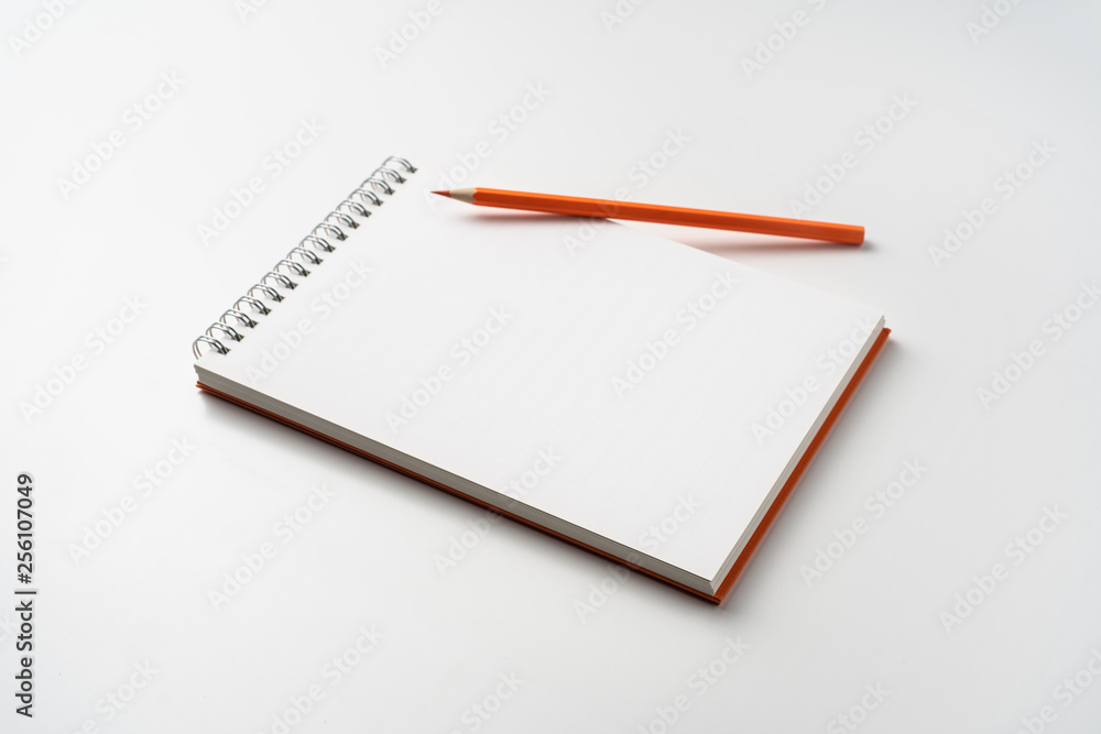 perspective view of spiral orange notebook perspective view of spiral orange notebook