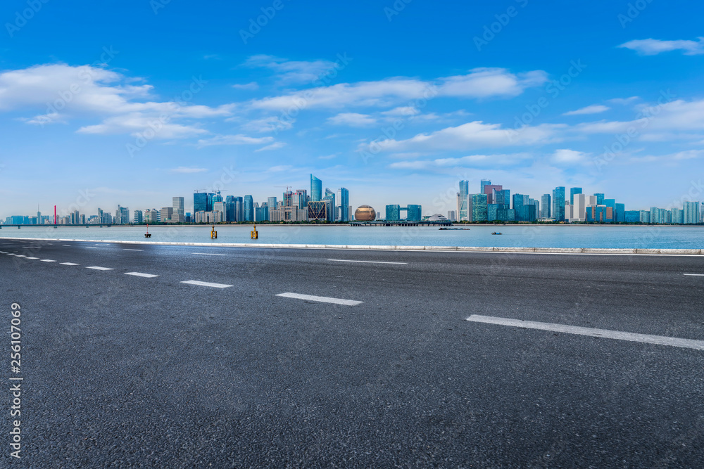 Foreground highway asphalt pavement city building commercial building office building