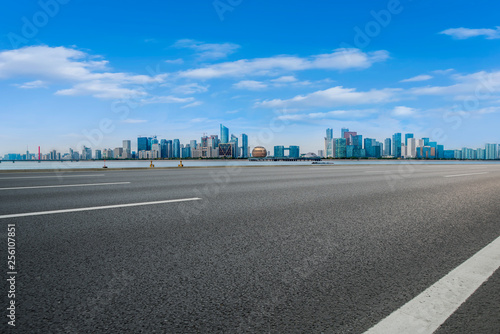 Foreground highway asphalt pavement city building commercial building office building