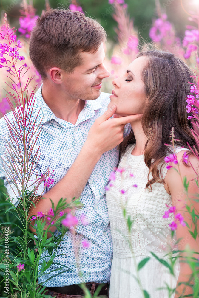 Lovers man and woman in the flowers of willow-tea Lovers man and woman in the flowers of willow-tea