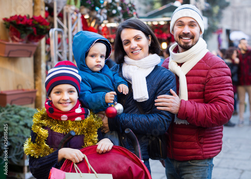 Happy family with children  at Christmas market