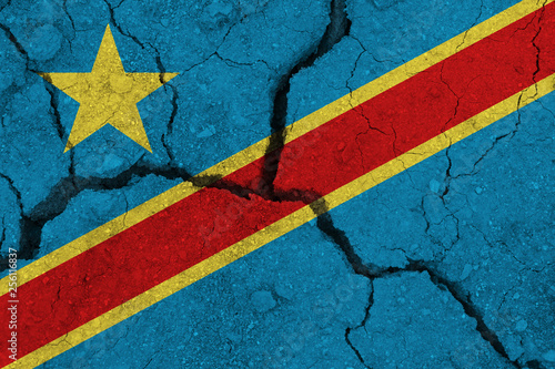 Democratic Republic of the Congo flag on the cracked earth