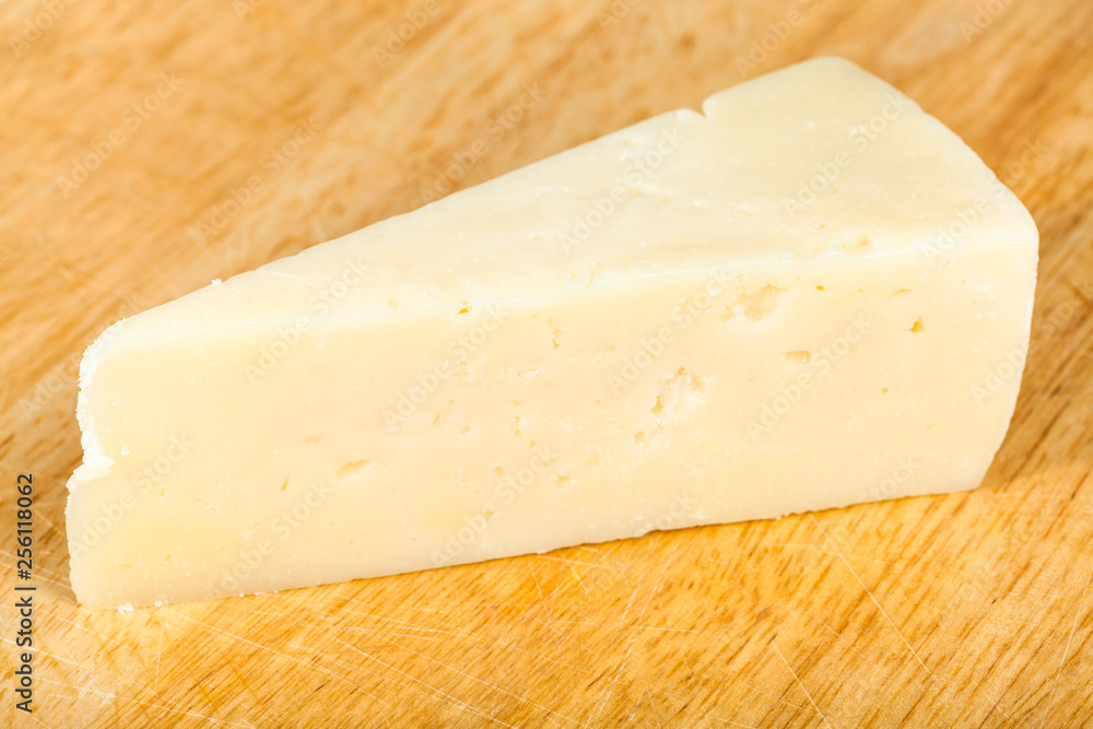 italian Pecorino Romano cheese on cutting board