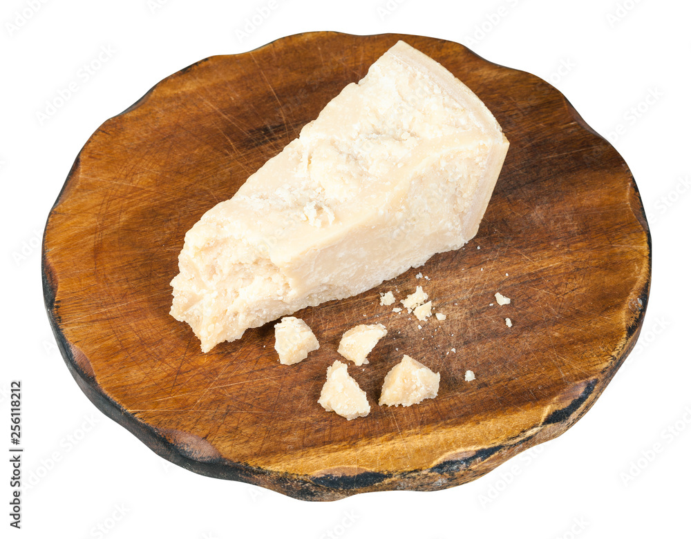 Parmigiano Reggiano cheese on dark board isolated Parmigiano Reggiano cheese on dark board isolated