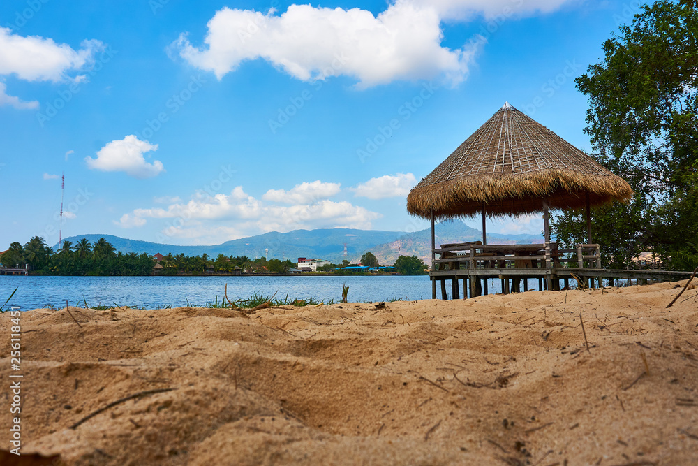 River beach with straw hut in Kampot Cambodia River beach with straw hut in Kampot Cambodia