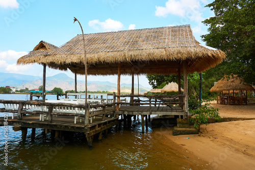 River beach with straw hut in Kampot Cambodia