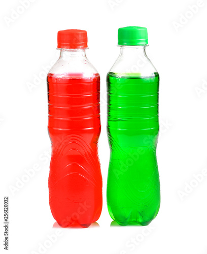 plastic bottles of soft drinks on white background