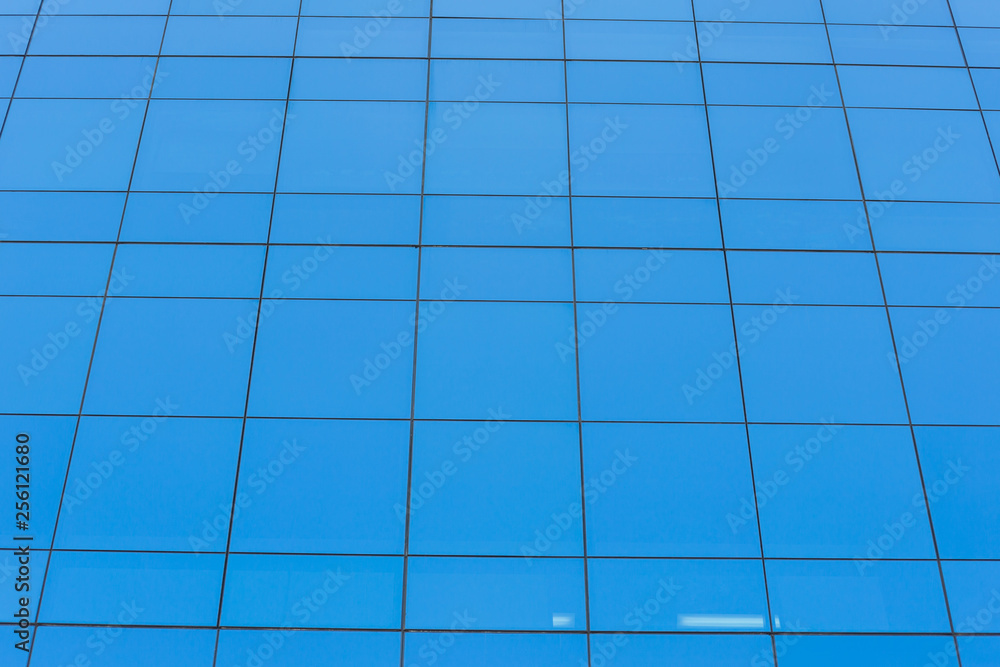 Modern office building with blue glass windows Modern office building with blue glass windows