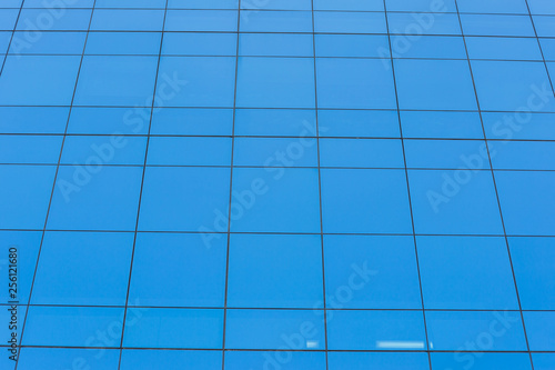 Modern office building with  blue glass windows