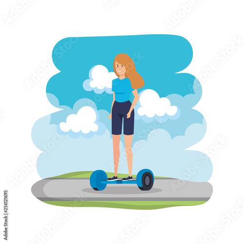 young woman in hoverboard electric on road