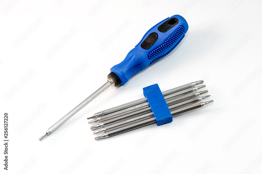Screwdriver with various nozzles on a white background. Screwdriver with various nozzles on a white background.