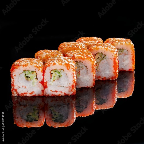 Japanese rolls, sushi on a black background
