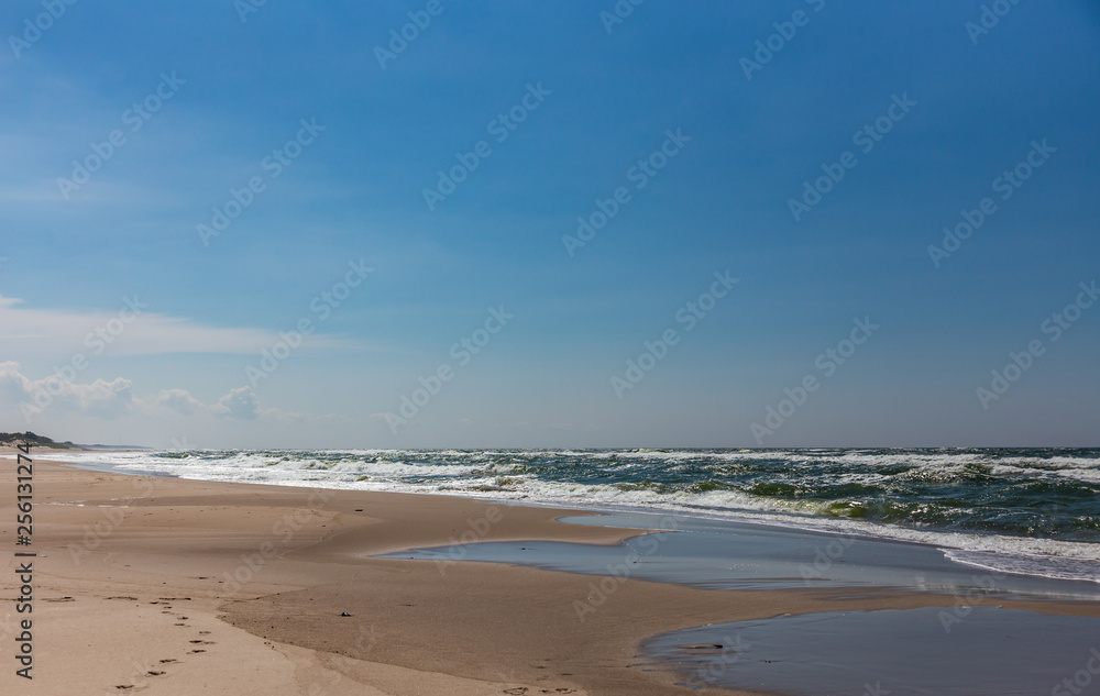 Sandy coast and waves from the Baltic Sea on the Curonian Spit, Russia Sandy coast and waves from the Baltic Sea on the Curonian Spit, Russia