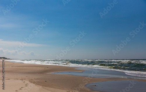 Sandy coast and waves from the Baltic Sea on the Curonian Spit  Russia
