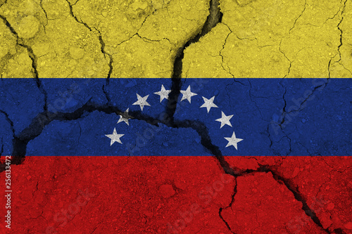 venezuela flag on the cracked earth