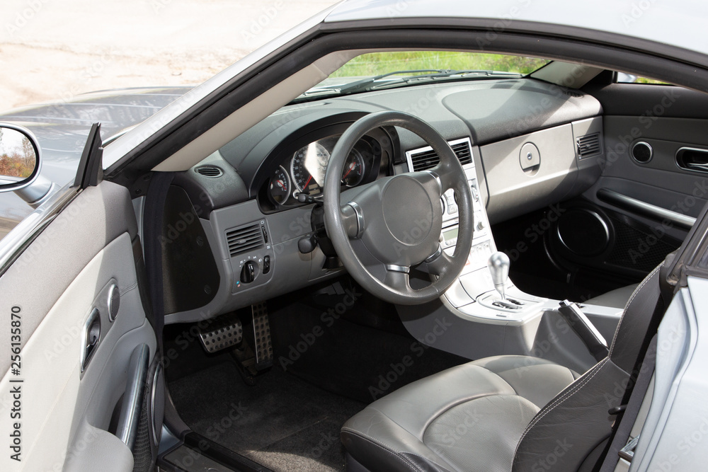 Sportscar dashboard modern grey and black leather interior of modern car