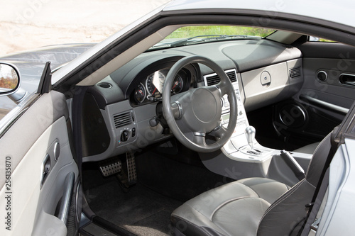 Sportscar dashboard modern grey and black leather interior of modern car