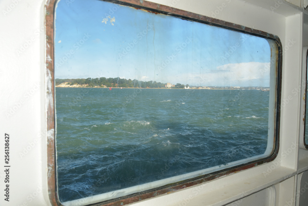 Fototapeta premium View through window of chain ferry across Poole harbour near Sandbanks, Dorset