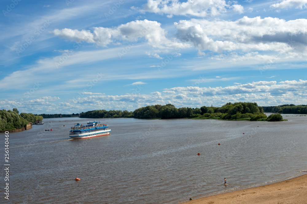 VELIKY NOVGOROD, RUSSIA - AUGUST 14, 2018: The Volkhov River in Velikiy Novgorod. On the river floats ship. Russia, Velikiy Novgorod.