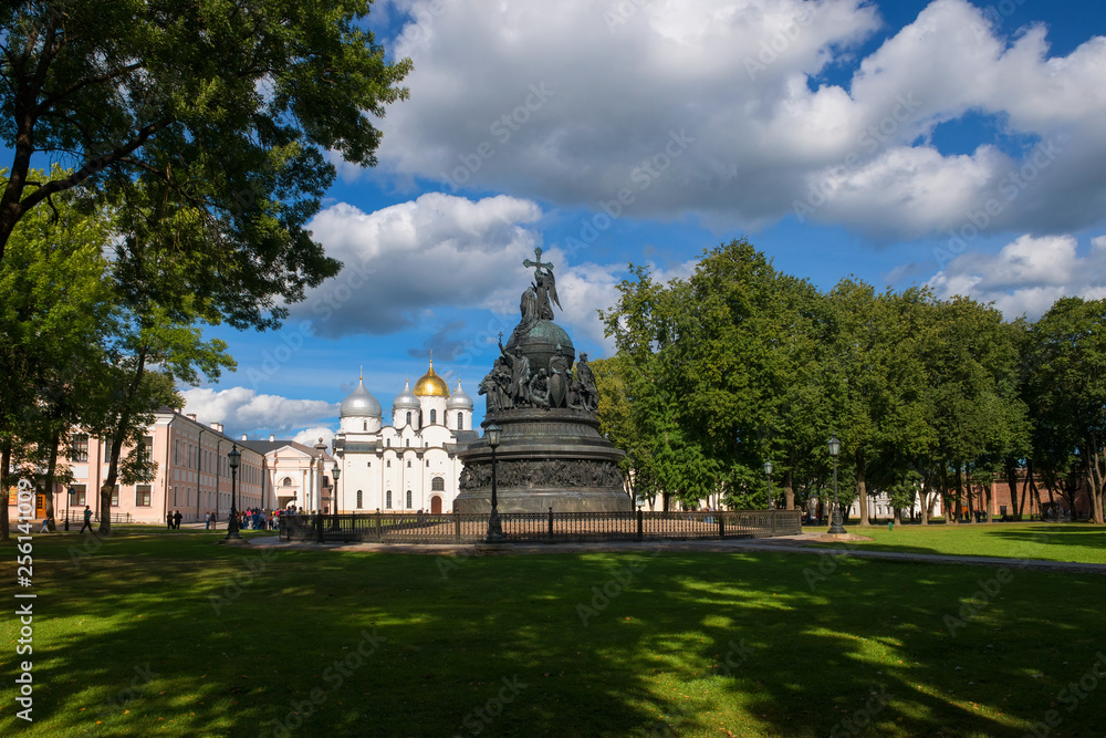 VELIKY NOVGOROD, RUSSIA - AUGUST 14, 2018: Monument Millenium of Russia on the background of St. Sophia Cathedral with tourists walking along in summer day