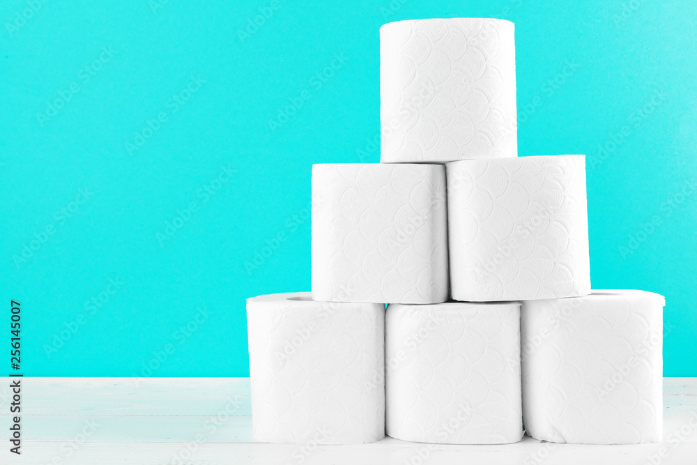 Toilet paper rolls on turquoise bright background Toilet paper rolls on turquoise bright background