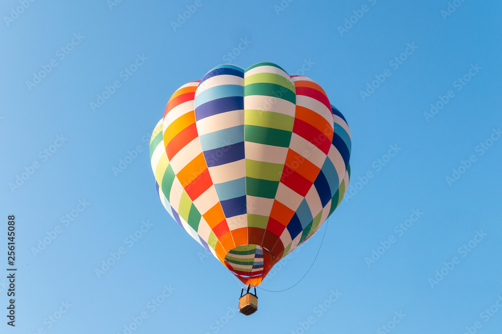 Hot air balloons flying in blue sky Hot air balloons flying in blue sky