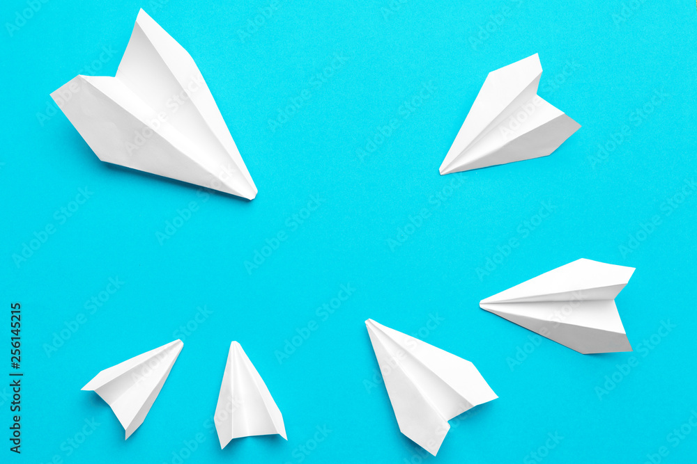 white paper airplane on a blue background white paper airplane on a blue background