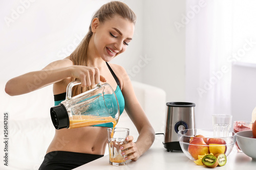 Young woman pouring healthy...