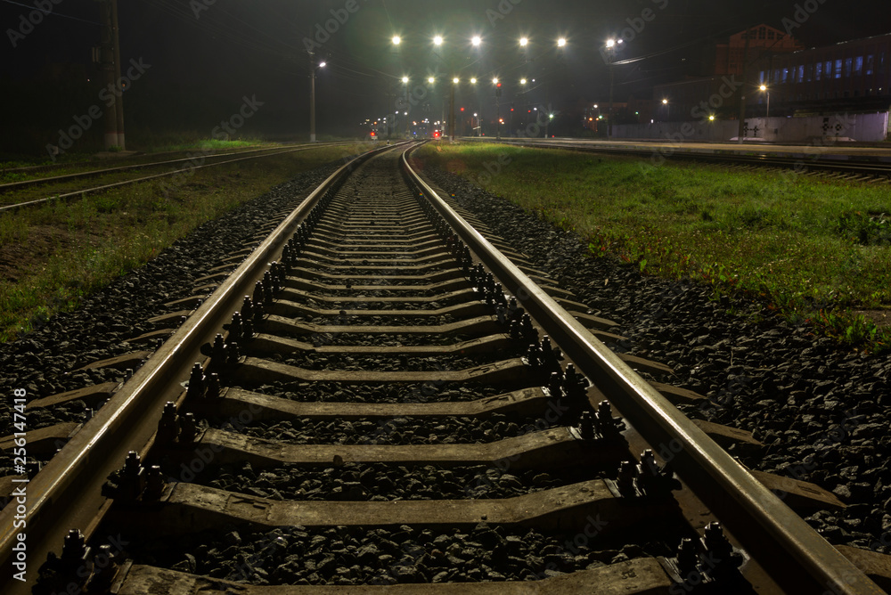 railway tracks in fog at night railway tracks in fog at night