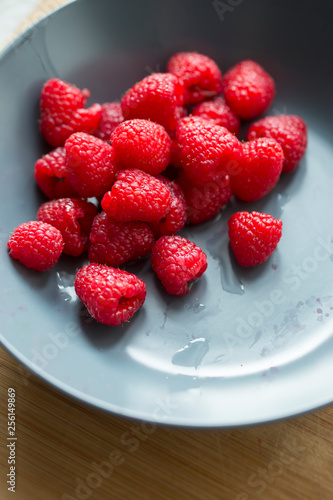 Fresh raspberries in bowl 
