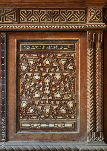 Single arabesque sash of an old mamluk era cupboard with geometrical decorations, Zeinab Khatoon historic house, Cairo, Egypt photo