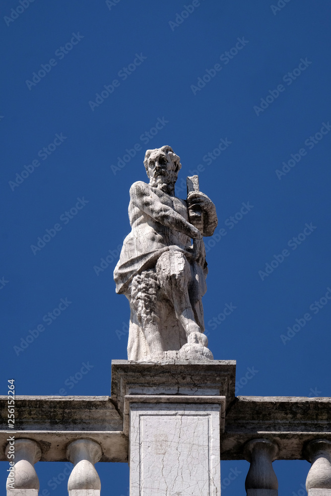 Statue at the top of National Library of St Mark`s Biblioteca Marciana, Venice, Italy, UNESCO World Heritage Sites