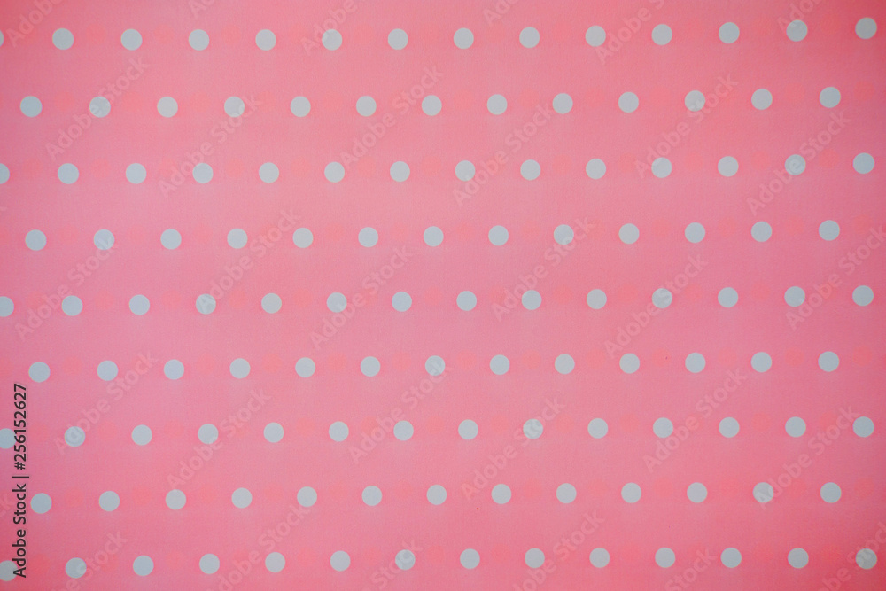 Pink Fabric and White Tiny Polka Dots. background and texture