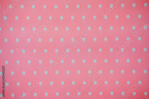 Pink Fabric and White Tiny Polka Dots. background and texture