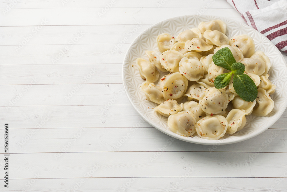 Dumplings stuffed with meat, ravioli, dumplings. Dumplings with stuffing. Russian cuisine. Copy space. Dumplings stuffed with meat, ravioli, dumplings. Dumplings with stuffing. Russian cuisine. Copy space.