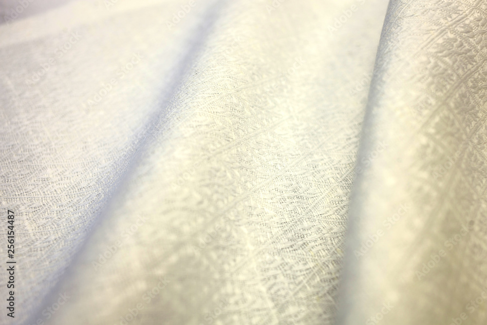 fabric sample of a milky white fabric with a pattern. Textile manufacture fabric sample of a milky white fabric with a pattern. Textile manufacture