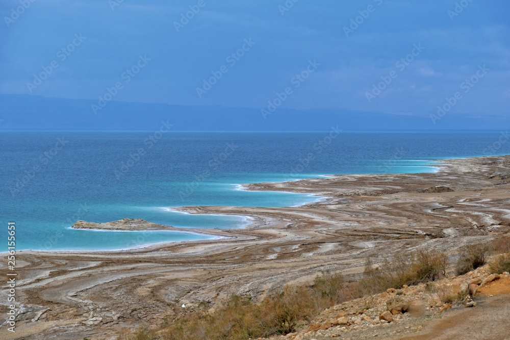 Beautiful green white salty coastline of Dead sea in Jordan