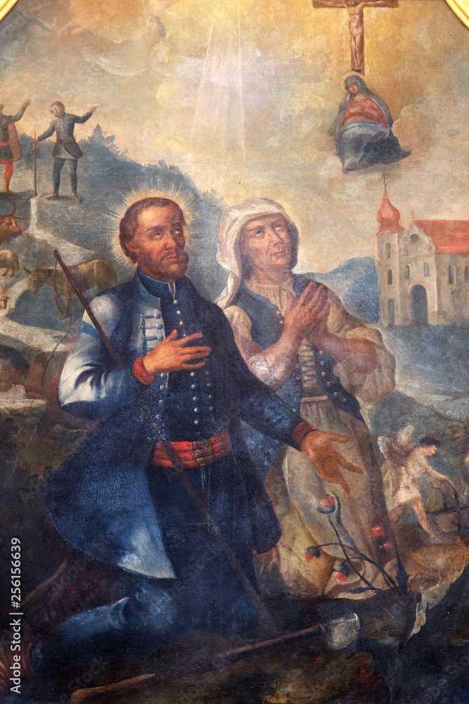 Fototapeta premium Saint Isidore And Maria Torribia, altarpiece in the Church of Assumption of the Virgin Mary in Pokupsko, Croatia