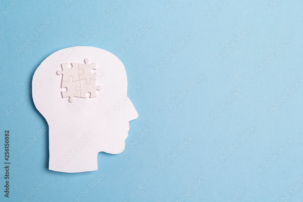 Autism Awareness Day concept with puzzles brain symbol on blue background. Autism Awareness Day concept with puzzles brain symbol on blue background.
