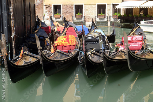 View of moored gondolas and historical buildings in Venice, Italy 